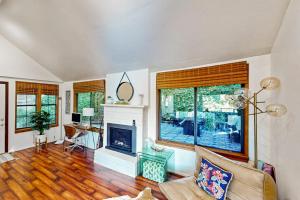 a living room with a couch and a fireplace at Monte Rio Vista Lodge in Monte Rio +25 photos