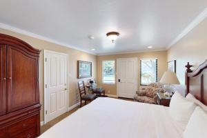 a bedroom with a bed and a couch and a chair at Silverado Resort and Spa 288 in Napa