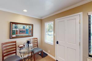 a room with a table and chairs and a door at Silverado Resort and Spa 288 in Napa