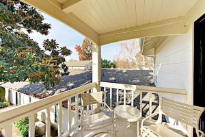 a porch with two chairs and a table at Silverado Resort and Spa 221 in Napa