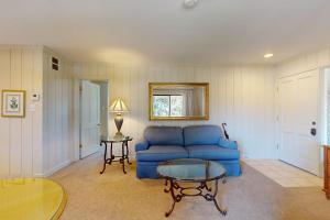 a living room with a blue couch and a table at Silverado Resort and Spa 221 in Napa +26 photos
