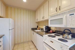 a kitchen with a white stove and a microwave at Silverado Resort and Spa 221 in Napa