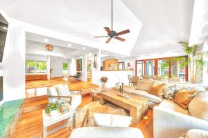 a living room filled with furniture and a ceiling fan at Zegarra Estate in Sebastopol