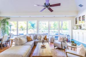a living room with a couch and a ceiling fan at Zegarra Estate in Sebastopol