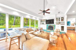 a living room with a couch and a fireplace at Zegarra Estate in Sebastopol +53 photos