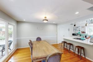 a kitchen with a table and chairs and a counter at Jewell Dreams in Santa Rosa