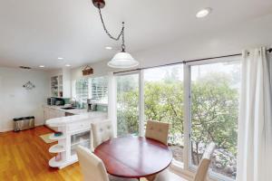 a kitchen and dining room with a table and chairs at Jewell Dreams in Santa Rosa +9 photos