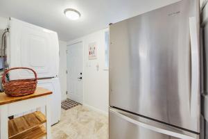 a kitchen with a stainless steel refrigerator at Wanderlust Cottage in Guerneville