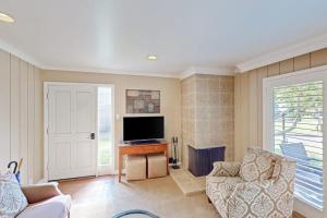 a living room with a tv and a fireplace at Silverado Resort and Spa 287 in Napa