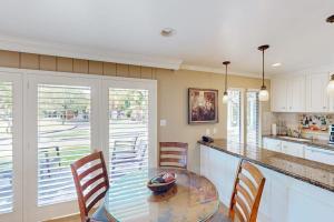 a kitchen with a table and chairs and a counter at Silverado Resort and Spa 287 in Napa +27 photos