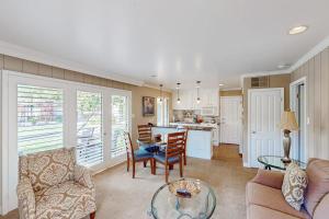 a living room with a table and chairs and a kitchen at Silverado Resort and Spa 287 in Napa