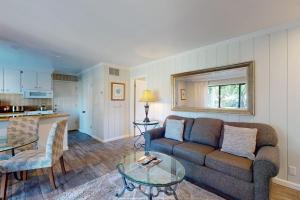 a living room with a couch and a table at Silverado Resort and Spa 353 in Napa