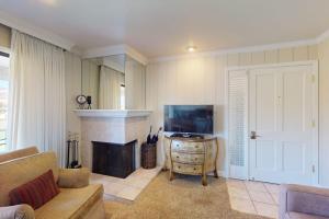 a living room with a couch and a fireplace at Silverado Resort and Spa 266 in Napa