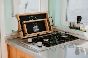 a kitchen stove with a picture of a skull on it at Zeleni Biser- Green Pearl in Lukavac +15 photos