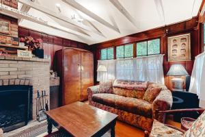 a living room with a couch and a fireplace at Clearheart Grove in Guerneville