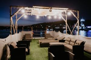a living room with couches and lights on a boat at Zeleni Biser- Green Pearl in Lukavac