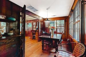 a kitchen and dining room with a table and chairs at Clearheart Grove in Guerneville