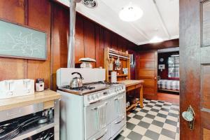 a kitchen with a white stove and a sink at Clearheart Grove in Guerneville +14 photos
