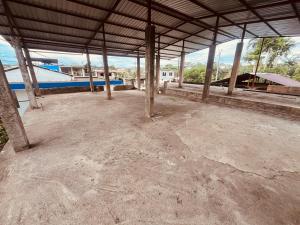a large empty room with a boat in the water at Apt 8 in Tena