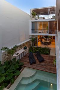 an external view of a house with a swimming pool at Casa del Paseo Luxury Home in Centro Rooftop Bar & 2 Pools in Mérida