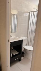 a bathroom with a sink and a toilet at Hotel La Morada in Treinta y Tres