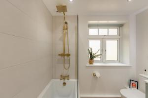 a white bathroom with a tub and a sink at 2 Bed in Waldron oc-v33536 in Waldron +20 photos
