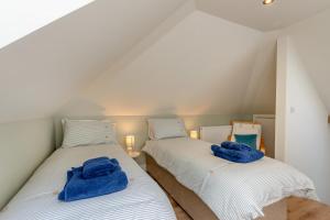 two beds in a room with blue towels on them at 2 Bed in Waldron oc-v33536 in Waldron