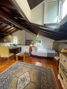 a bedroom with a bed and a desk in a room at Mansarda Portofino in Portofino