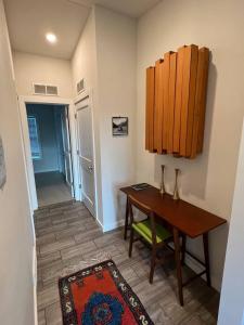 a dining room with a table and a table and a hallway at The Pinyon - Mountain View Retreat in Carbondale +8 photos