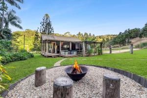 a fire pit in the middle of a yard at Cascade Springs in North Tumbulgum