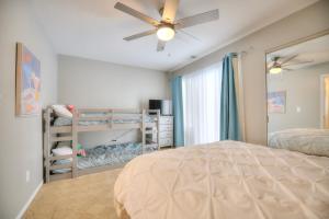 a bedroom with a bed and a ceiling fan at Newly Renovated Condo in Harborside! in South Haven