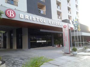a large building with a sign on the side of it at Bristol Evidence in Goiânia