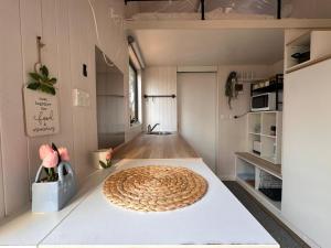 a room with a large rug on a table at Tiny House Adventure by Tiny Away in Tallarook +12 photos