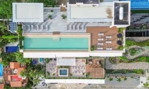 an aerial view of a house with a swimming pool at Maralma Bucerias 1 half Blocks from Beach Sleeps 4 in Bucerías