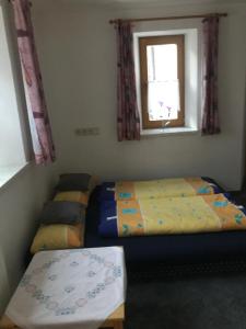 Ein Bett oder Betten in einem Zimmer der Unterkunft Haus Ramsbacher