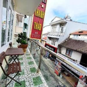 a view of a street with a table and a building at Thanh Thao Dalat Hotel in Da Lat