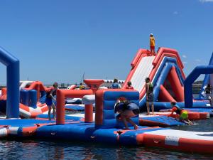 a group of people playing in a water park at Fairview Lakeside Cottage Metung in Metung