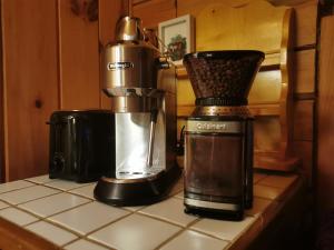 a coffee maker sitting on top of a counter at Gîte de l'herboriste spa et vue sur la fjord in Sainte-Rose-du-Nord