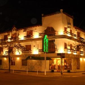 a building with a green sign in front of it at Salta Hotel in Venado Tuerto