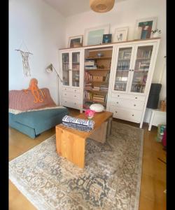 a living room with a couch and a coffee table at Quinta das Rosas - Beach 500m away in Figueira da Foz
