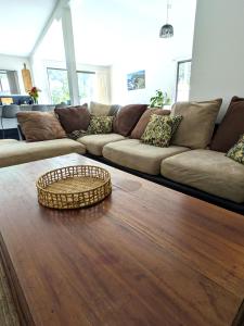 a living room with a couch and a table at Friends With Bienefelts in Turners Beach