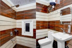 a bathroom with wooden walls and a toilet and a sink at Super Hotel O Greater Noida West Link Road Formerly Advent in Noida