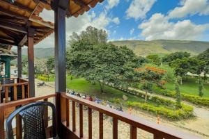 a balcony with a view of a park at Apartahotel Balcones de Nariño 2 in Villa de Leyva