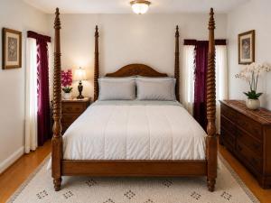 a bedroom with a large bed with a wooden frame at Fall River Stay Stylish 2BR Urban Haven Suite in Fall River