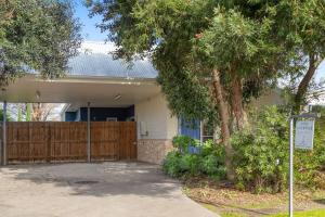 a house with a fence and a gate at Indigo Blue in Robe