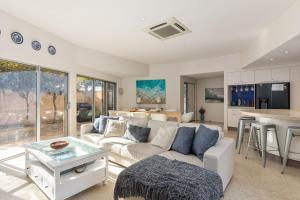 a living room with a couch and a table at Indigo Blue in Robe