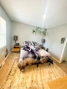 a bedroom with a large bed in a room at Triple Crown KC in Kansas City