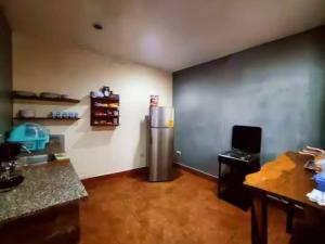 a kitchen with a stainless steel refrigerator in a room at Hotel Casona Macondo, Granada, Nicaragua in Granada +109 photos
