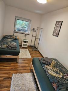 a room with two beds and a window at Premium Home 2 in Busingen am Hochrhein