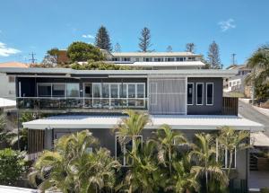 an aerial view of a house with palm trees at Bay Properties The Chill in Yamba